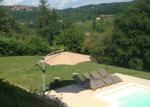 the views over the pool and the bastide village of Domme up the hill 