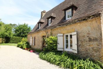 the front side of the house, at the level of the car park area 