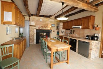 The kitchen with its large wooden table