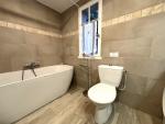 the adjacent newly fitted bathroom