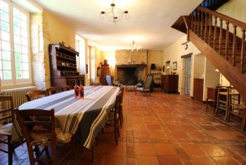 the huge living room with dining area and sitting area